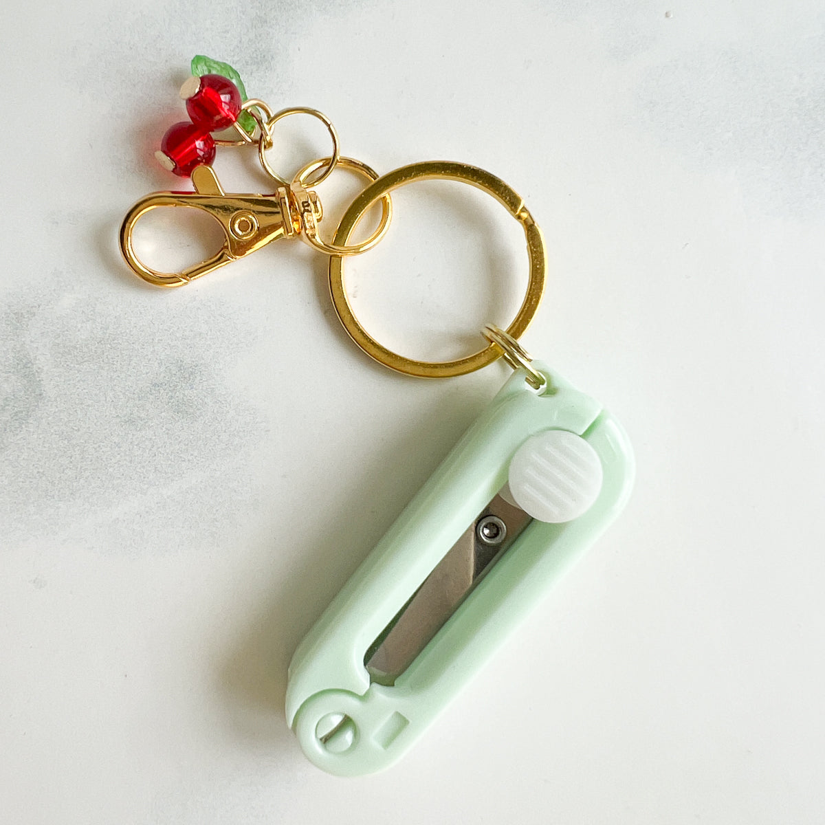 nanaCompany Buttons Card Sewing Tin Kit featuring Cherry Charm Retractable Scissors