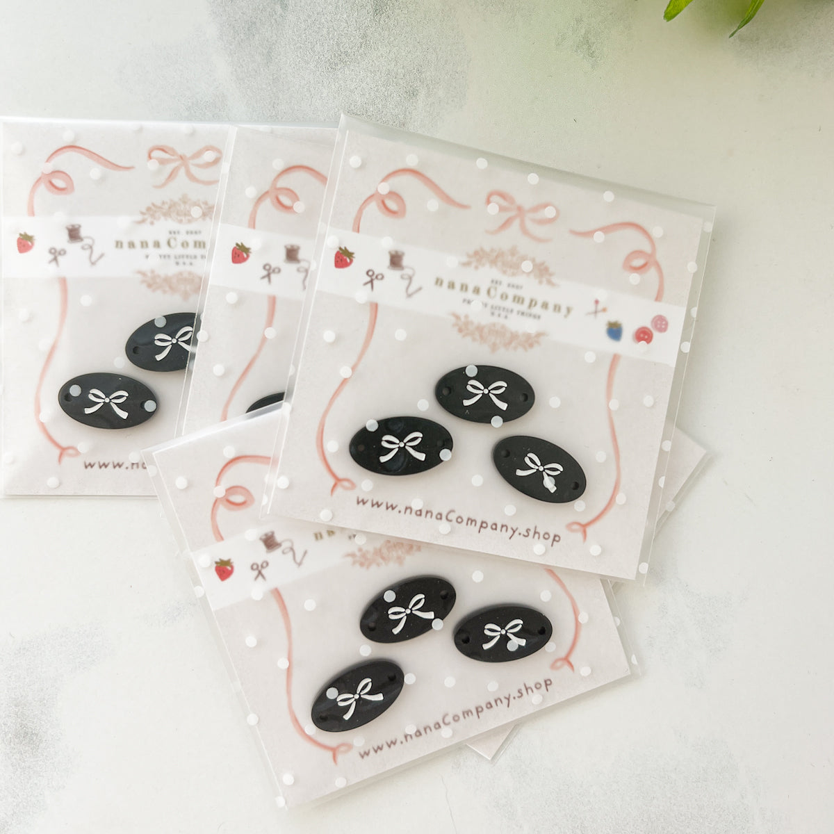 White bow on Black Oval buttons embellishments