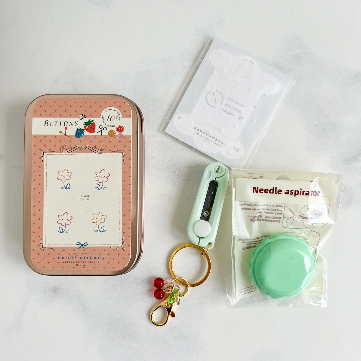 nanaCompany Buttons Card Sewing Tin Kit featuring Cherry Charm Retractable Scissors