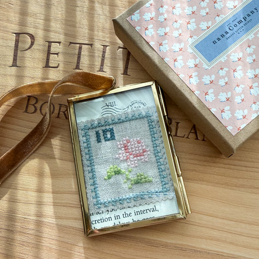 Glass-framed Cross-stitched Flower Postal Stamp Handmade by Amy Sinibaldi