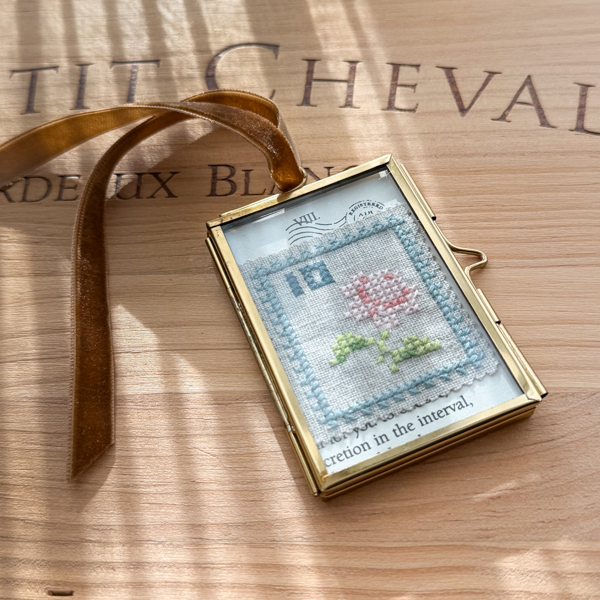 Glass-framed Cross-stitched Flower Postal Stamp Handmade by Amy Sinibaldi