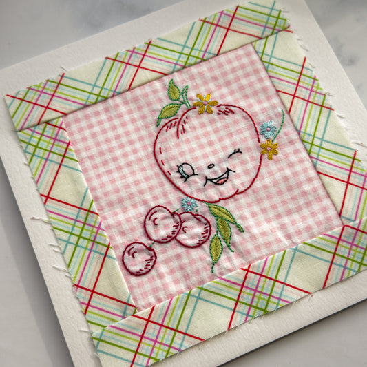 Hand embroidered Apple + Berries Quilt Block made by Amy Sinibaldi