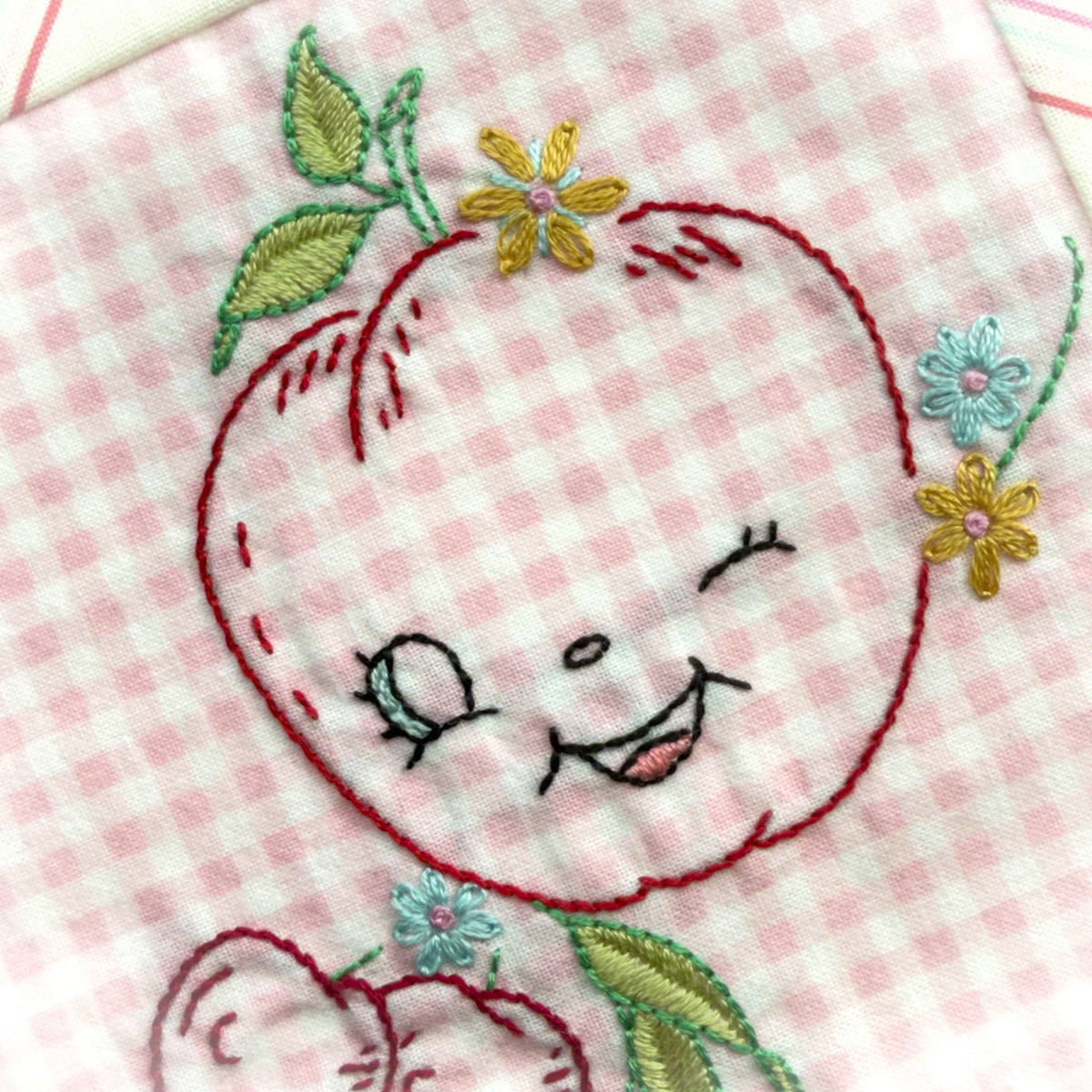 Hand embroidered Apple + Berries Quilt Block made by Amy Sinibaldi
