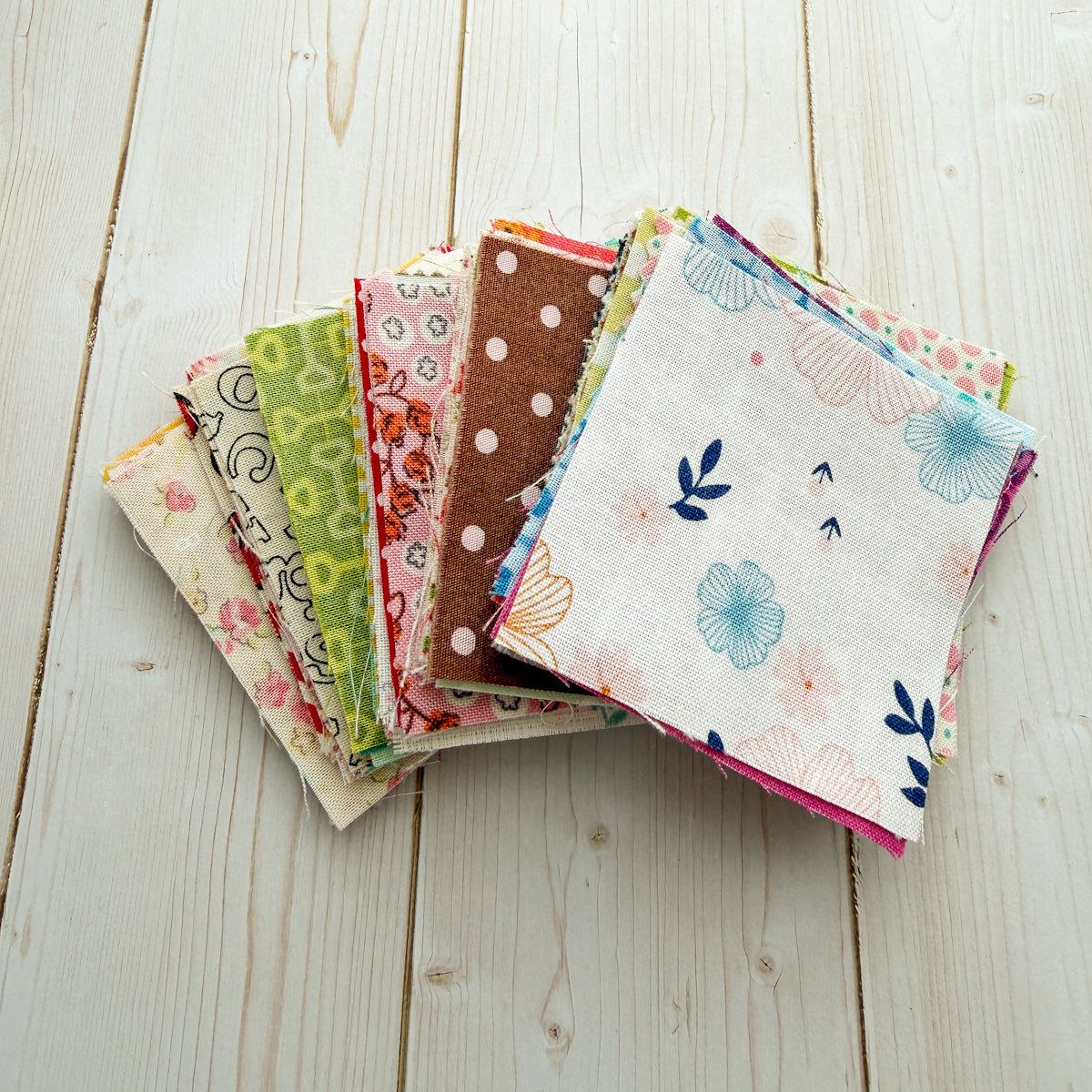 Mini Surprise Box of 2 1/2” squares Assorted Fabrics