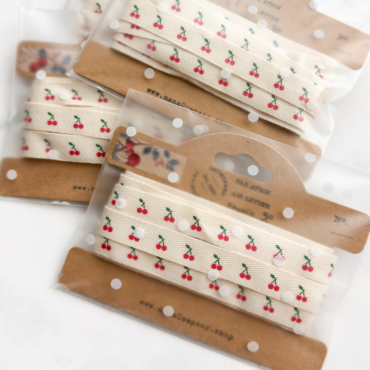 Petite Cherry Printed Cotton Ribbon on a Kraft Bobbin | Two yards
