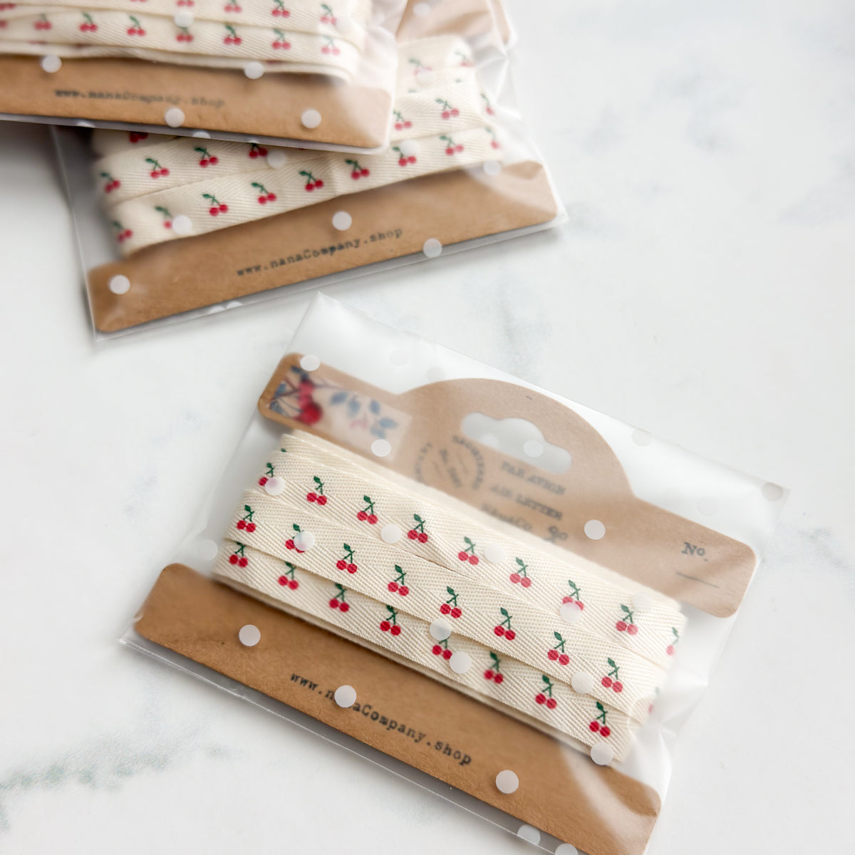 Petite Cherry Printed Cotton Ribbon on a Kraft Bobbin | Two yards