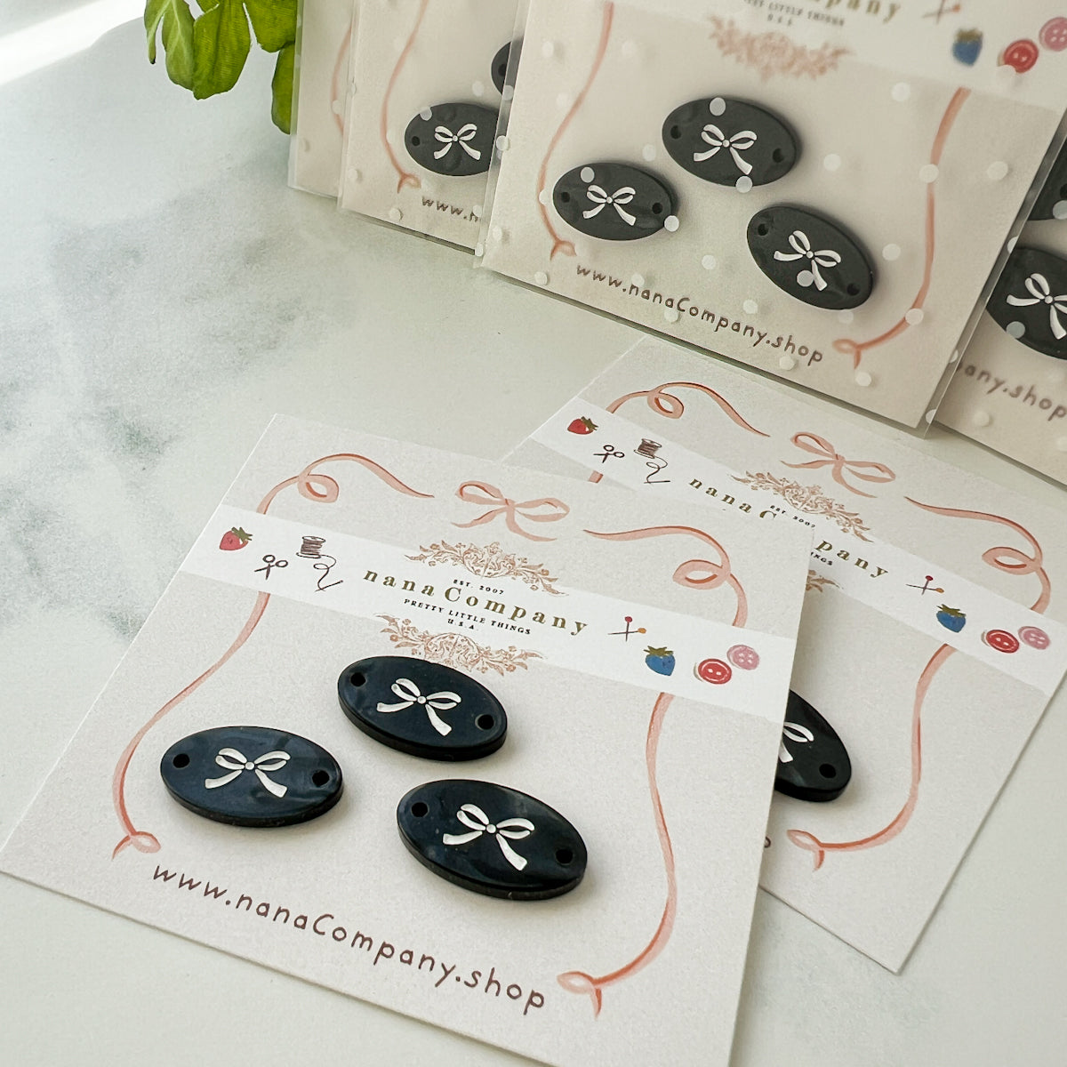 White bow on Black Oval buttons embellishments