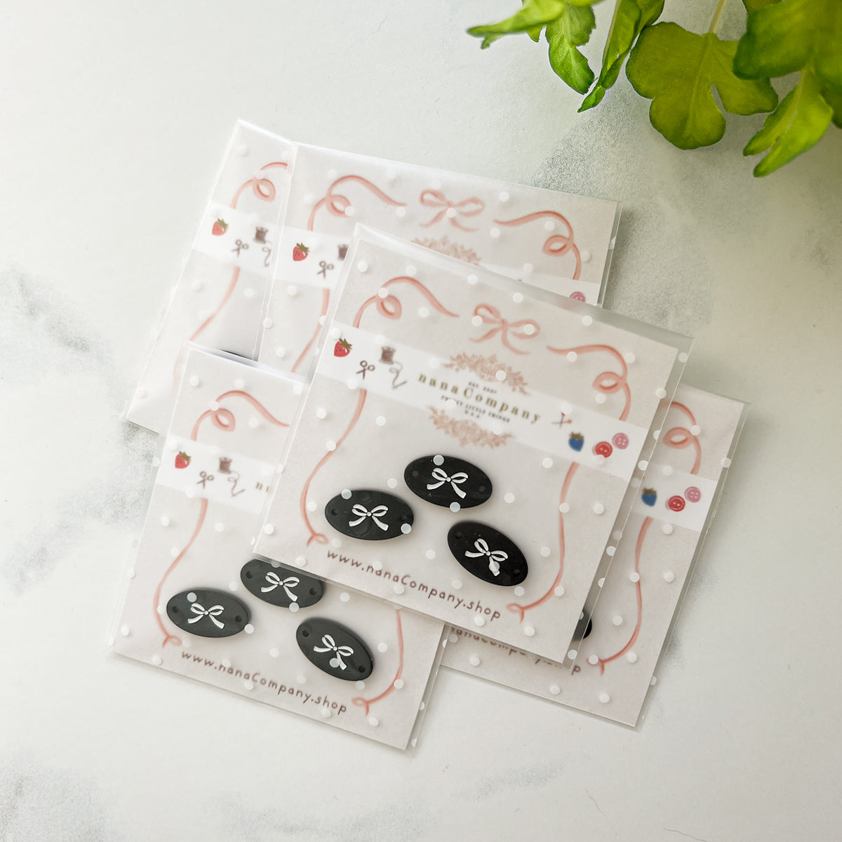 White bow on Black Oval buttons embellishments