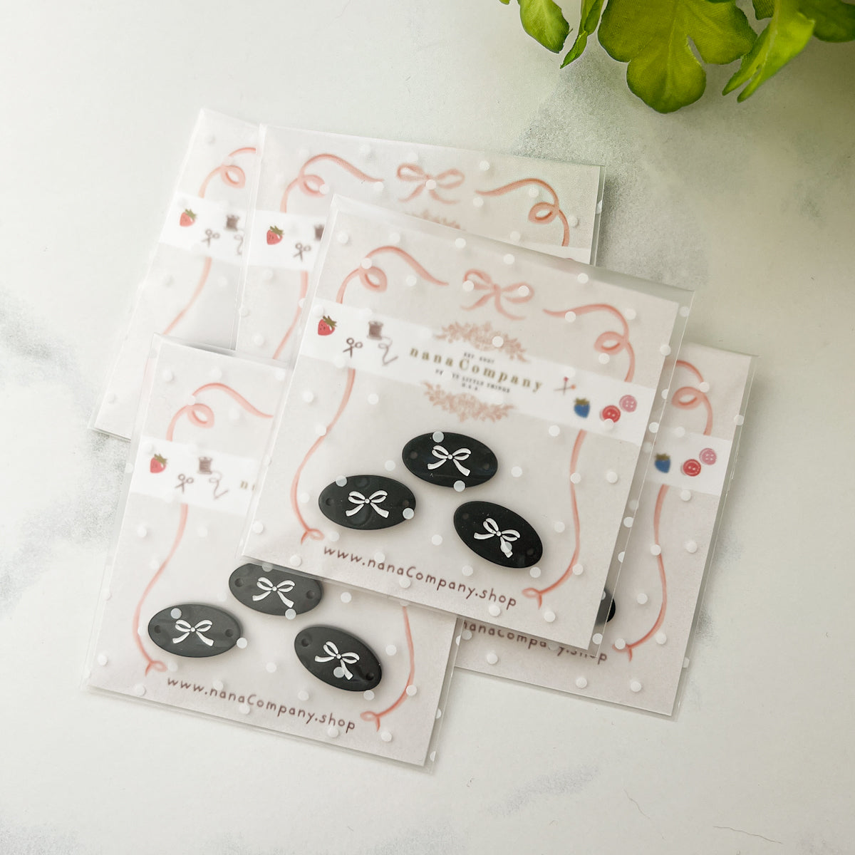 White bow on Black Oval buttons embellishments