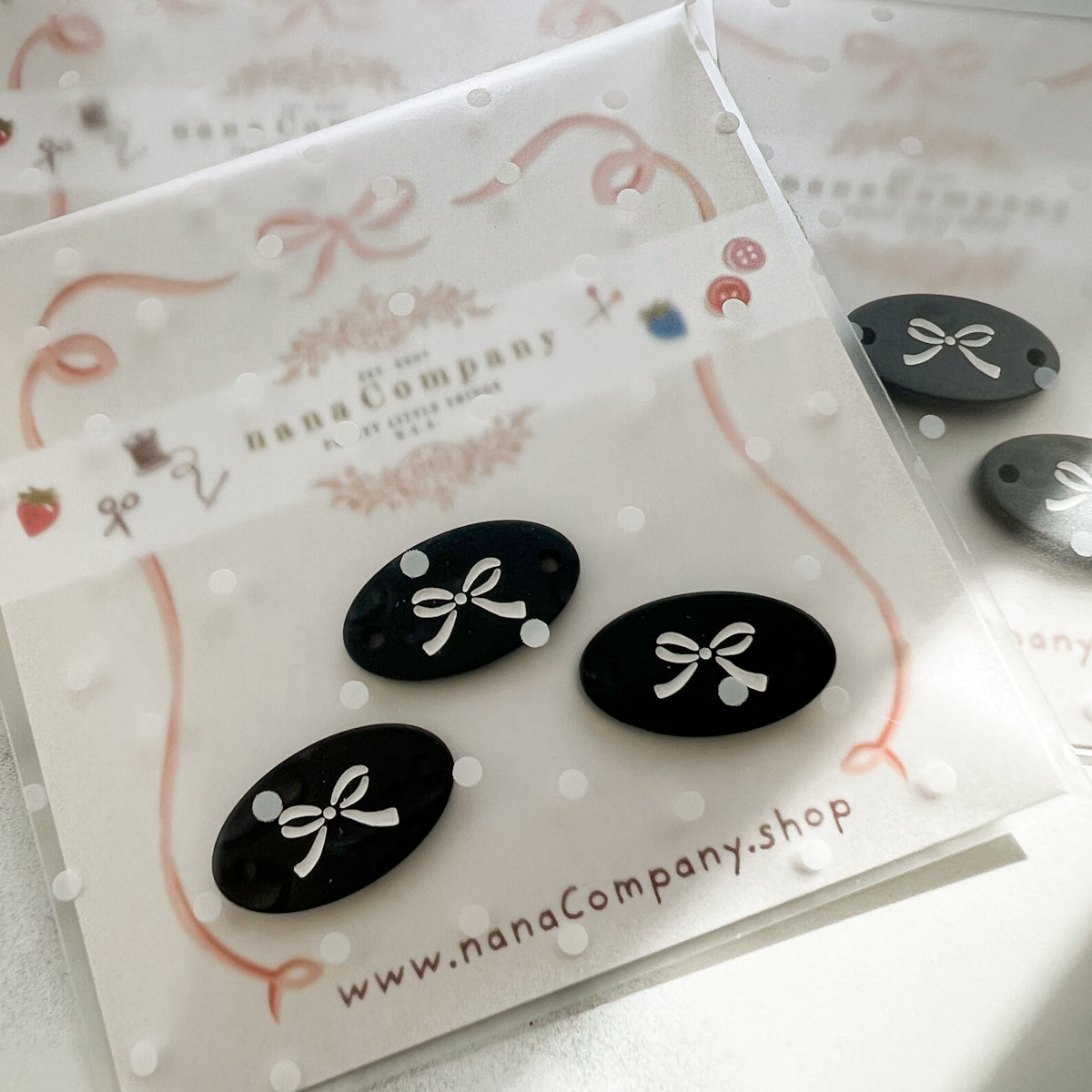 White bow on Black Oval buttons embellishments